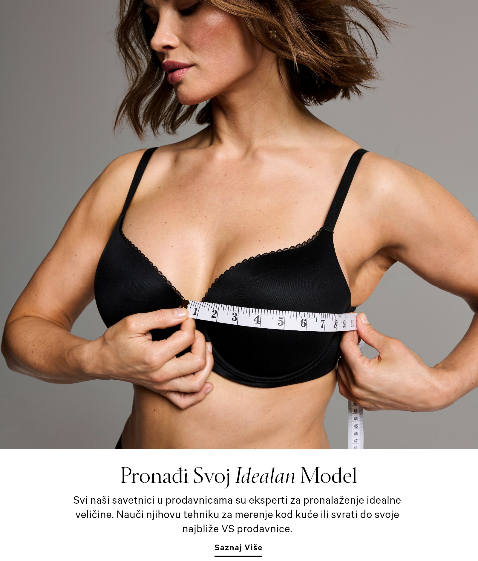 Woman measuring her bust size with a meter while wearing Victoria's Secret black comfort bra