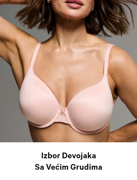 Woman posing in a Victoria's Secret full coverage baby pink bra.